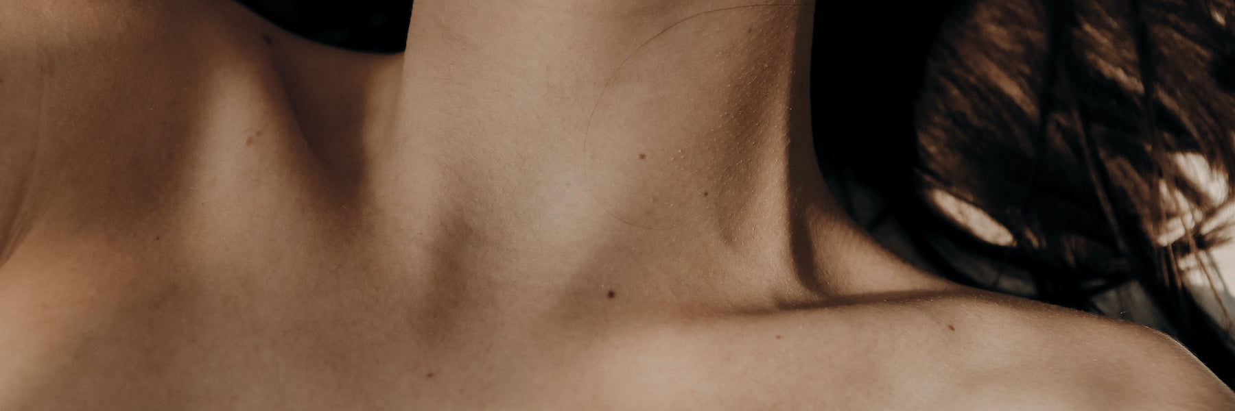 woman lying down showing her decolletage area