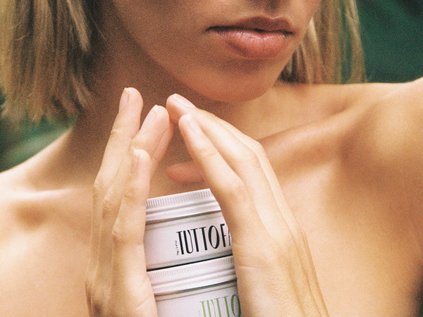 Two Tuttofare tallow balm tins stacked