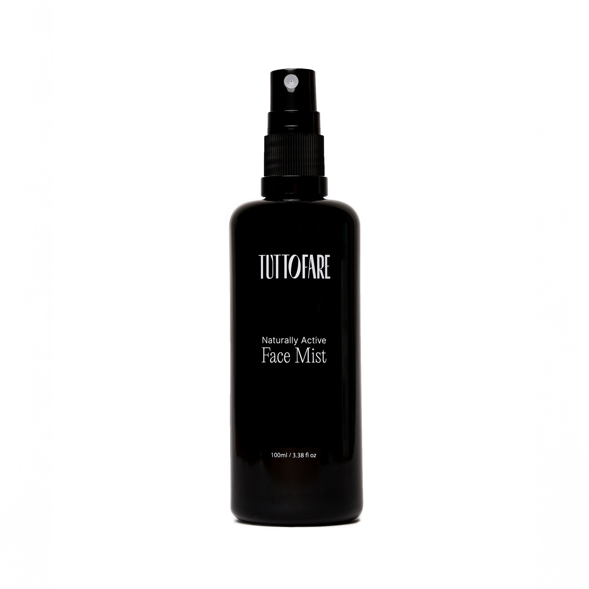 A black spray bottle labeled 'Tuttofare Naturally Active Face Mist' with white text, indicating it is a hydrating face mist with 100ml capacity.