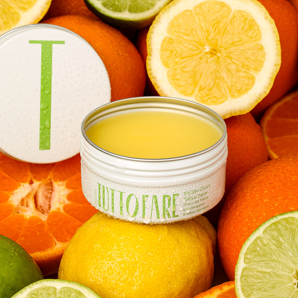 TUTTOFARE Sicilian Citrus Tallow Balm with Australian grass fed and grass finished beef tallow surrounded by citrus fruits showing scent